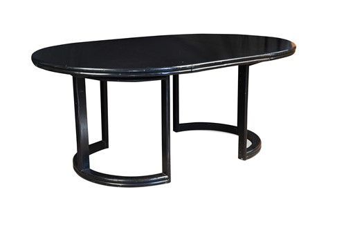 Lot 219 - An Art Deco style ebonised circular extending dining table