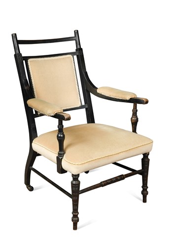 Lot 150 - An Aesthetic movement elbow chair in the manner of E. W. Godwin (1833-1886)