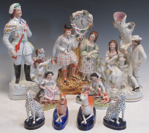 Lot 193 - A collection of Staffordshire figures, to...