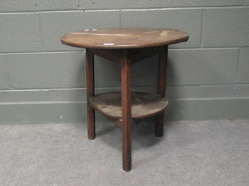 Lot 622 - An 18th century oak cricket two-tier table, 58...