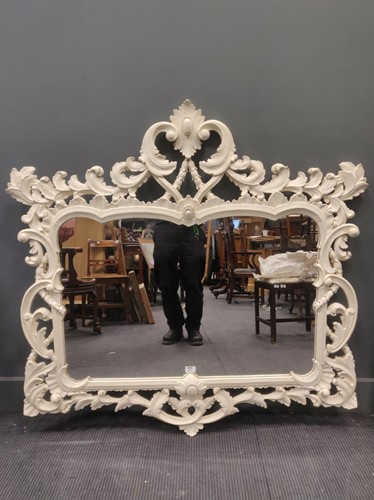 Lot 671 - A white painted rococo style wooden wall...