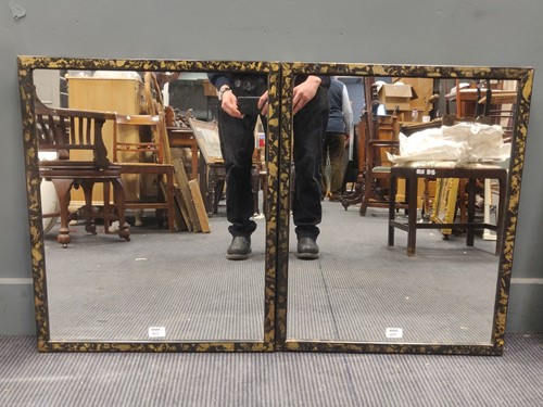 Lot 672 - A pair of wall mirrors, the black painted...
