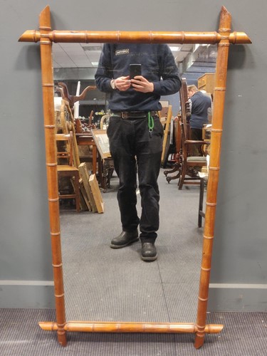 Lot 674 - A rectangular bamboo wall mirror, 74 x 128cm
