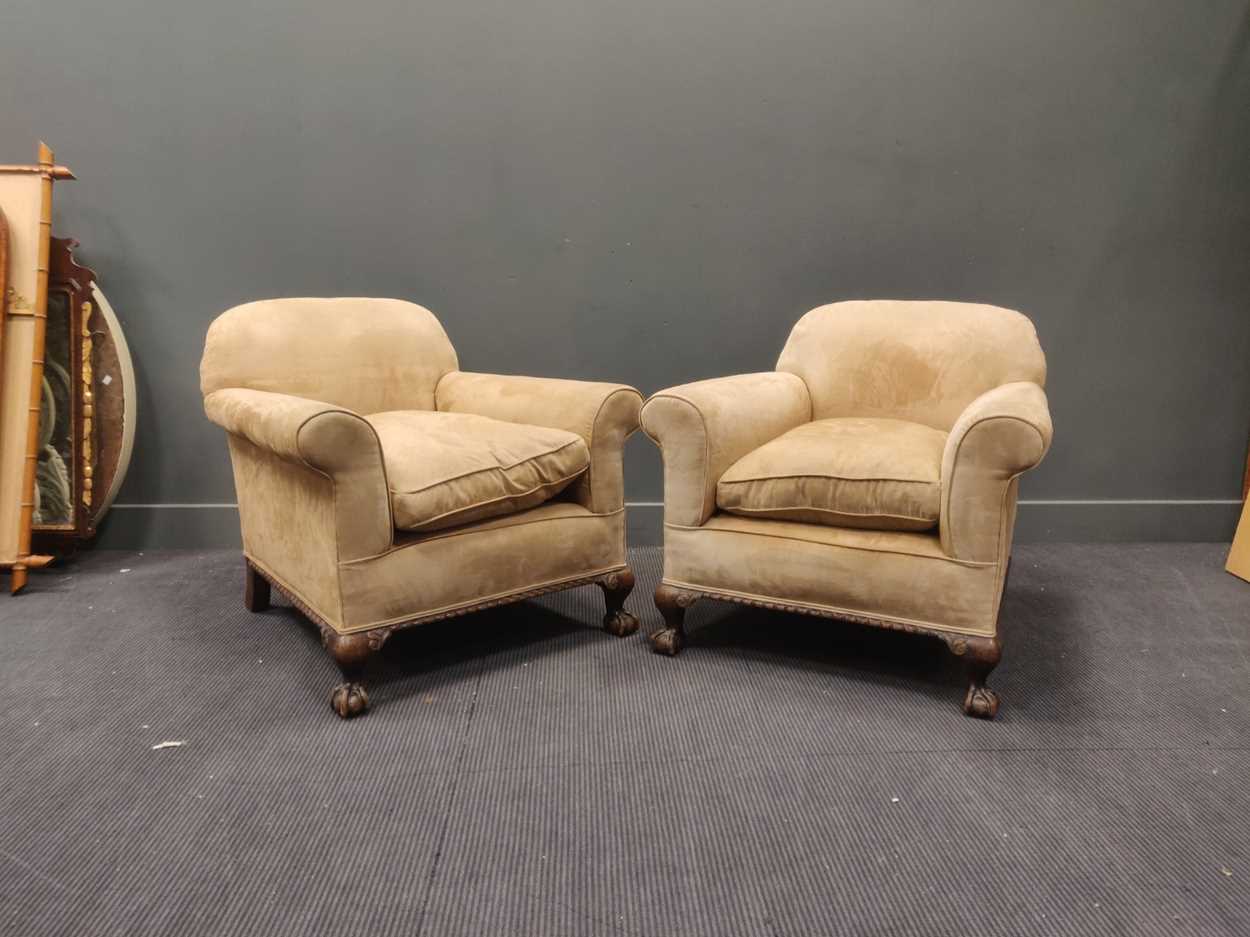 Lot 681 - A pair of 1920s/30s armchairs, the deep seats...