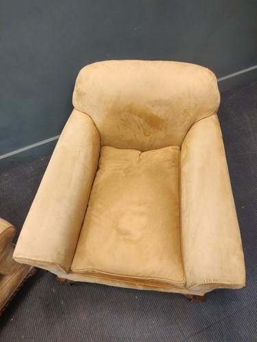 Lot 681 - A pair of 1920s/30s armchairs, the deep seats...