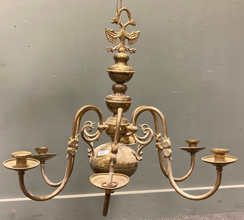 Lot 680 - A brass six branch chandelier, in 17th century...