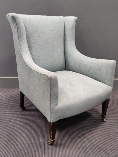 Lot 682 - An early 20th century armchair with light blue...