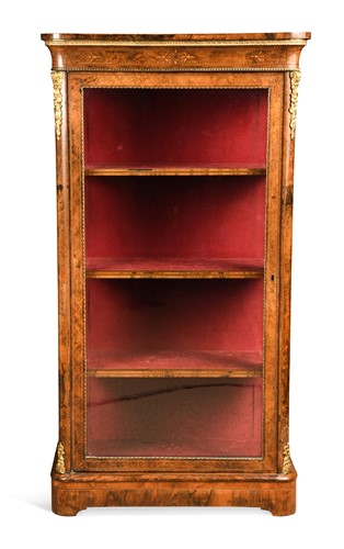 Lot 597 - A Victorian burr walnut glass fronted bookcase with gilt metal mounts