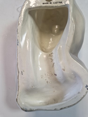 Lot 49 - A Goldscheider pottery wall mask