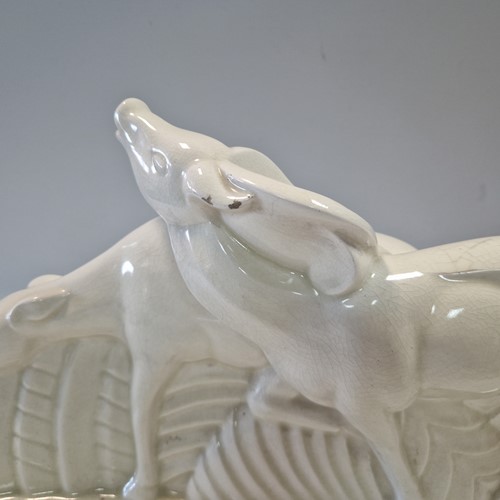Lot 48 - Primavera, France, an Art Deco crackle glaze model of a man with a wheelbarrow