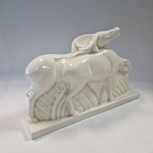 Lot 48 - Primavera, France, an Art Deco crackle glaze model of a man with a wheelbarrow