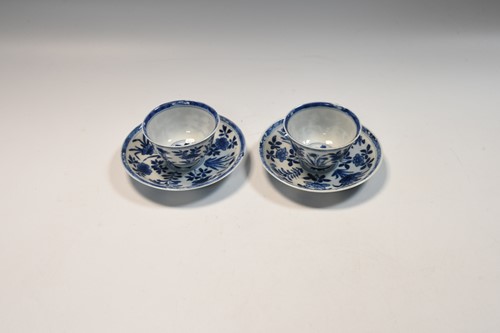 Lot 4 - A pair of Chinese blue and white tea bowls and saucers, Kangxi Period (1662-1722)