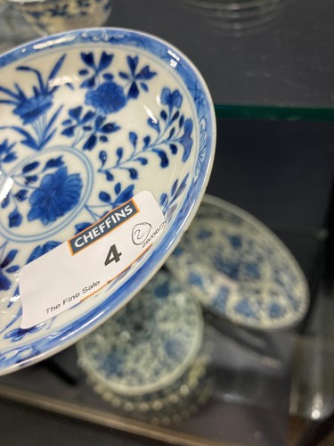 Lot 4 - A pair of Chinese blue and white tea bowls and saucers, Kangxi Period (1662-1722)