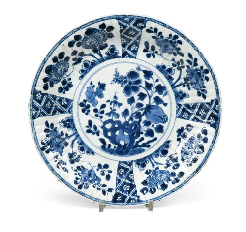 Lot 2 - A Chinese blue and white porcelain shallow fluted dish,  Kangxi (1662-1722)