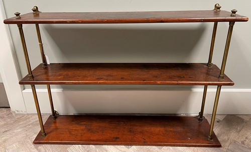 Lot 700 - A 19th century set of mahogany hanging shelves...