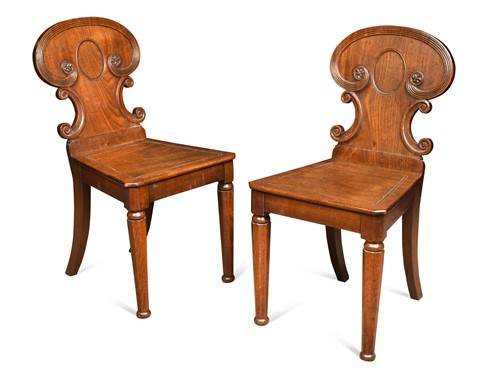 Lot 658 - A pair of Regency mahogany hall chairs