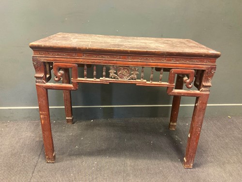 Lot 459 - A Chinese red lacquered hardwood carved centre...
