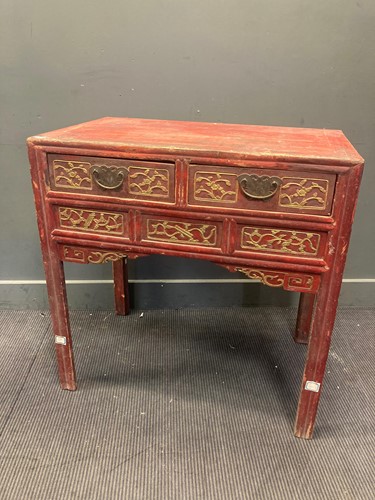 Lot 466 - A Chinese red and gilt painted table with two...