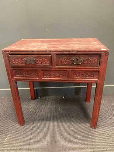 Lot 467 - A Chinese red painted table with two frieze...