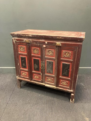 Lot 460 - A Chinese painted red and black four-door...