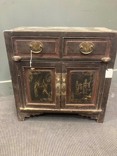 Lot 488 - A Chinese hardwood small cabinet with a pair...