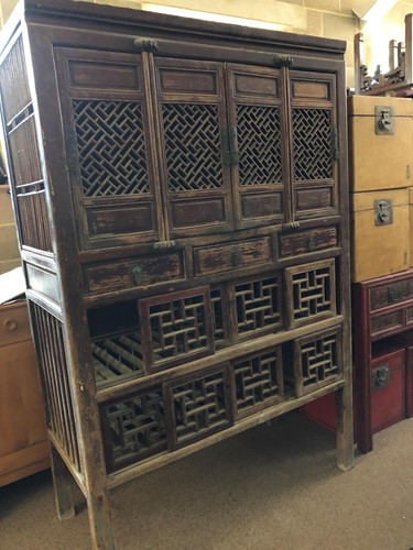 Lot 458 - A Chinese hardwood game larder with open fret...