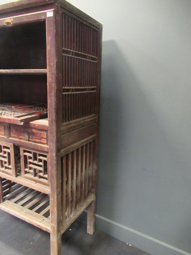 Lot 458 - A Chinese hardwood game larder with open fret...
