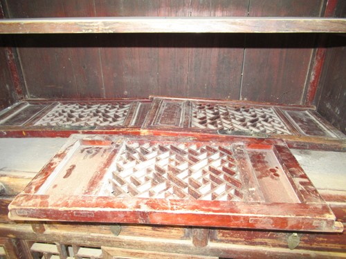 Lot 458 - A Chinese hardwood game larder with open fret...