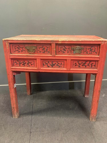 Lot 485 - A Chinese red painted hardwood table with two...