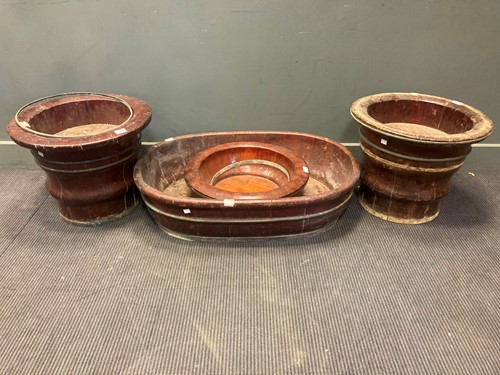 Lot 501 - A pair of brass banded wooden planters and...