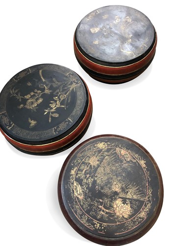 Lot 104 - A pair of Chinese red and black lacquered shallow circular food boxes and covers