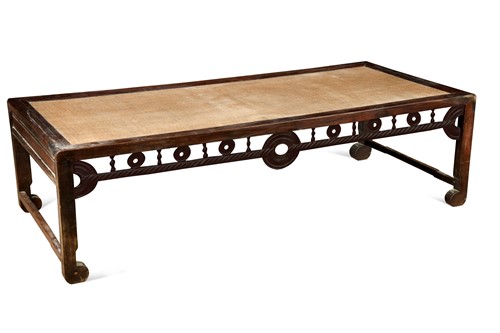 Lot 124 - A Chinese carved hardwood day bed, late Qing Dynasty