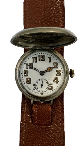 Lot 195 - Unsigned - A base metal 'trench' style 'wristlet' hunter wristwatch