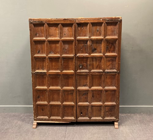 Lot 422 - A 19th century pine panelled two door cupboard...