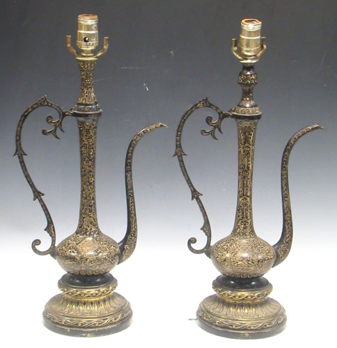 Lot 33 - A pair of large Indian black metal gilt...