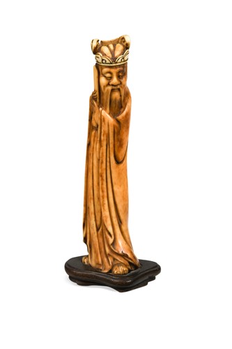 Lot 97 - A Chinese carved staghorn and ivory immortal, late Ming Dynasty, early 17th century