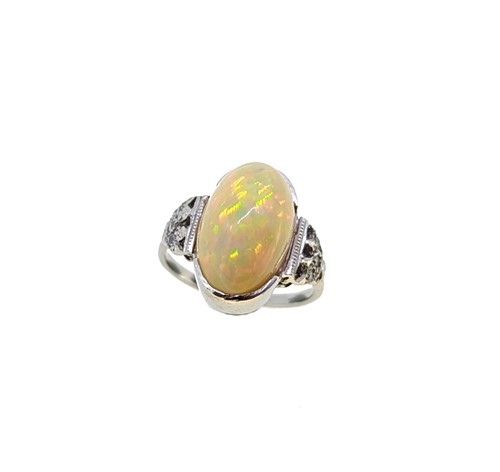 Lot 81 - An opal and diamond dress ring