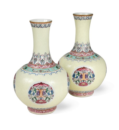 Lot 61 - A pair of Chinese pale yellow ground bottle vases