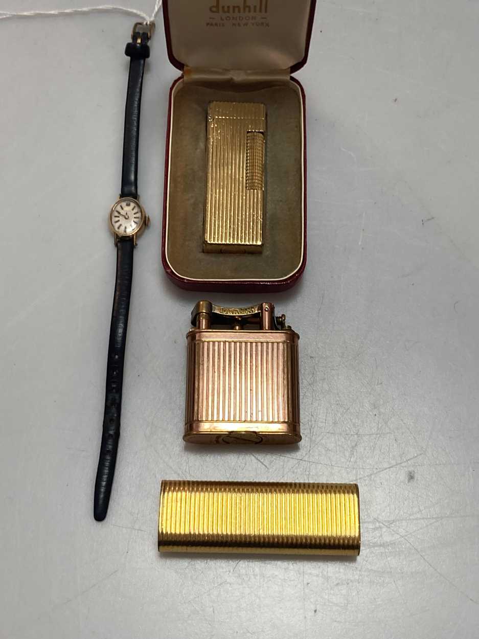 Lot 167 - A Cartier cigarette lighter, a Dunhill...