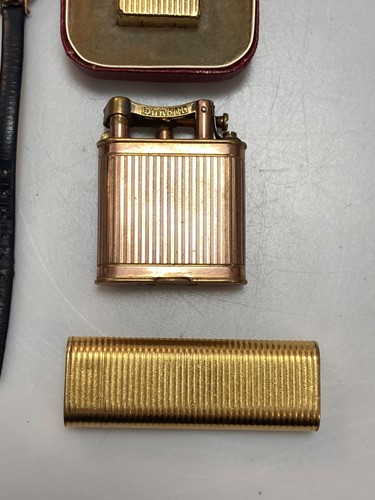 Lot 167 - A Cartier cigarette lighter, a Dunhill...