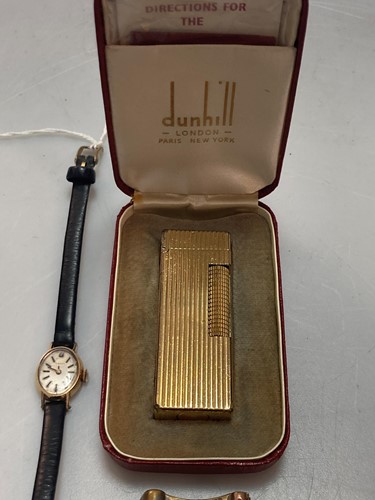 Lot 167 - A Cartier cigarette lighter, a Dunhill...