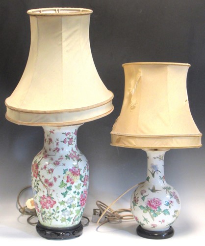 Lot 100 - Two Chinese famille rose lamps one of...