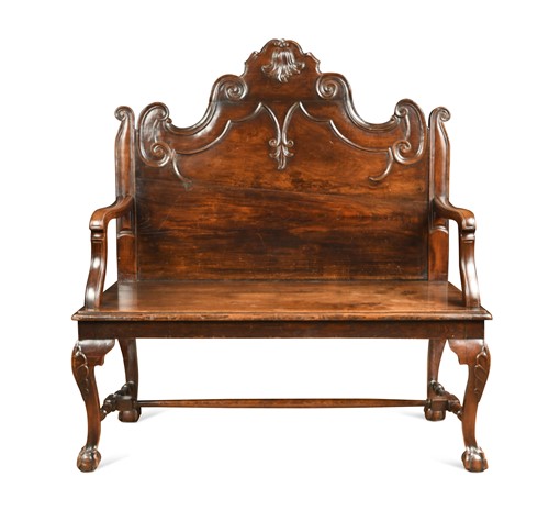 Lot 607 - A Portuguese oak and fruitwood high back hall seat, 19th century