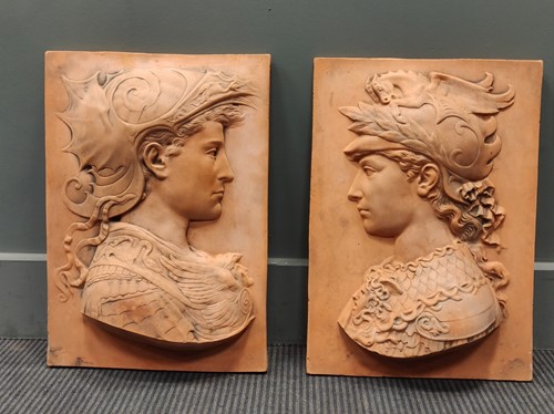 Lot 80 - A pair of terracotta plaques depicting relief...