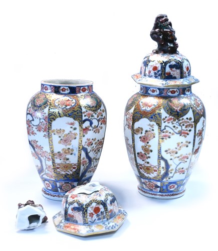 Lot 137 - A pair of Japanese octagonal panelled vases and covers, late 19th century