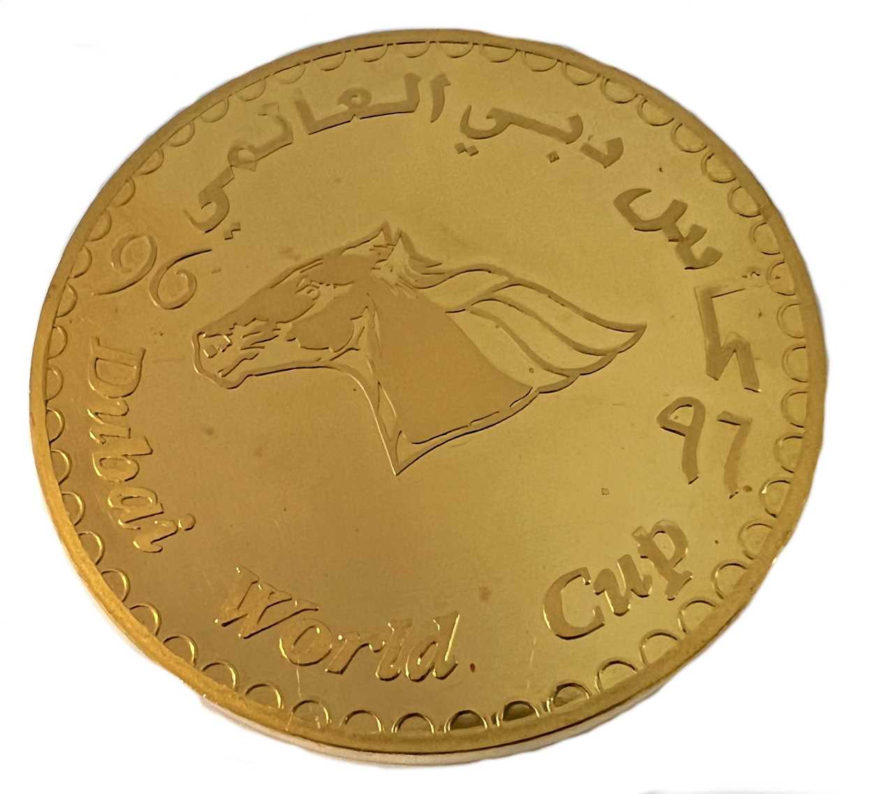 Lot 284 - A Dubai metalwares coin commemorating the inaugural Dubai World Cup horse race & shopping festival