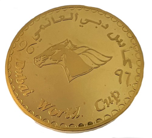 Lot 284 - A Dubai metalwares coin commemorating the inaugural Dubai World Cup horse race & shopping festival