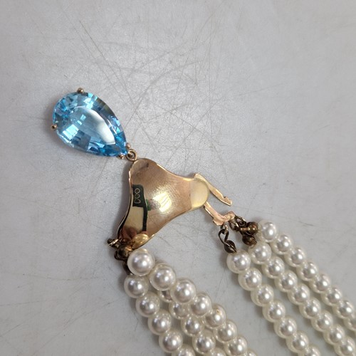Lot 193 - A three row imitation pearl necklace with a...