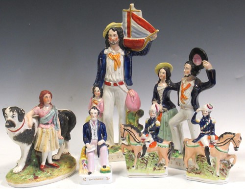 Lot 89 - Six Staffordshire figures, to include 'Begging...
