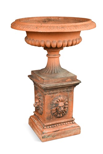 Lot 873 - A terracotta urn on a plinth base, 20th century